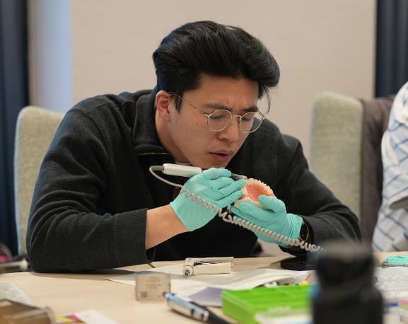 Clinician completing practical course work